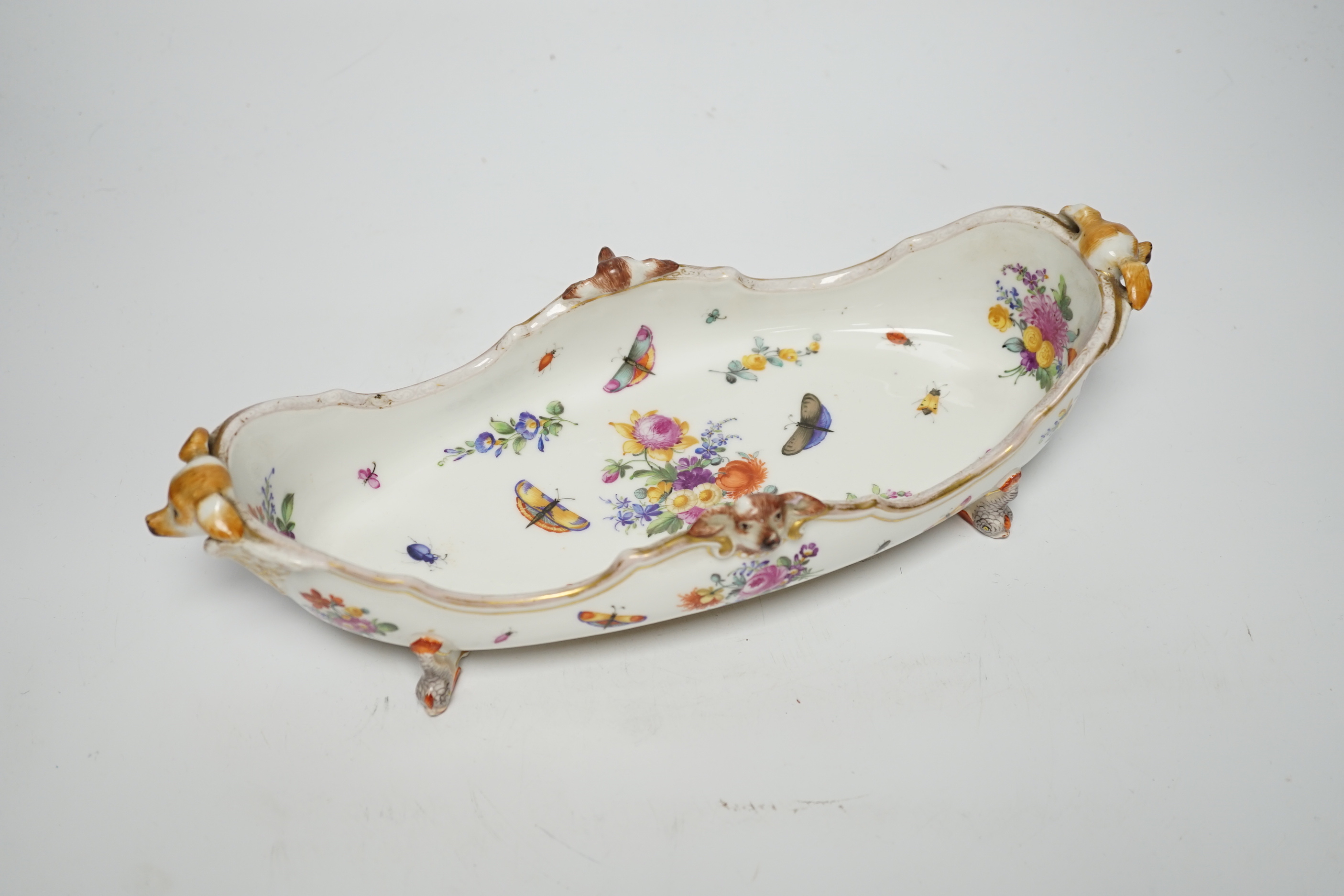 A Dresden Helena Wolfsohn boat-shaped dish, with dog head ornamentation, 34cm wide